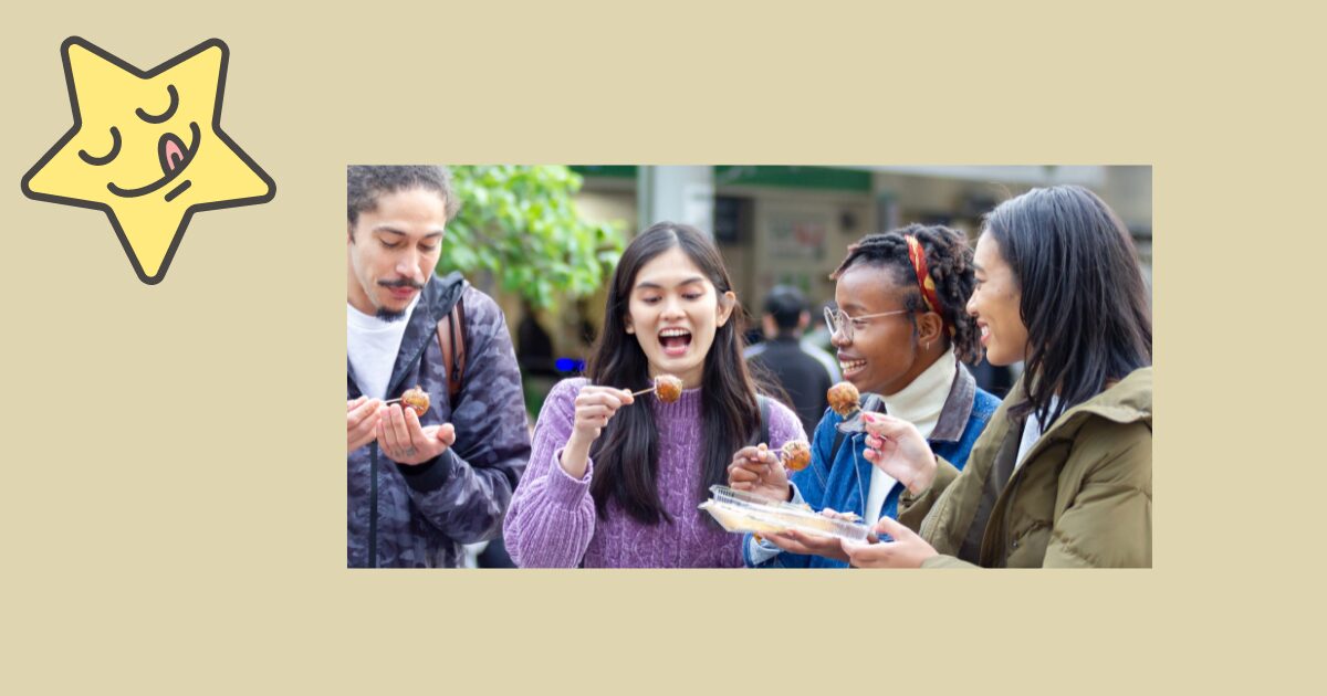 外国人たちが日本の食べ物を楽しく食べている画像